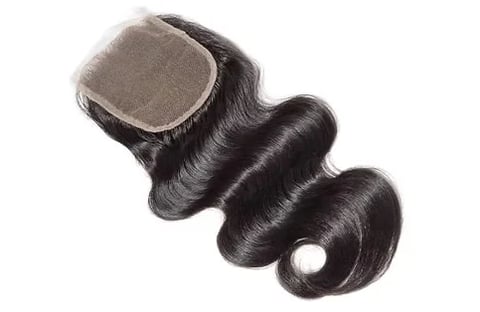 Black hair closure with body wave texture and sheer lace top panel on white background